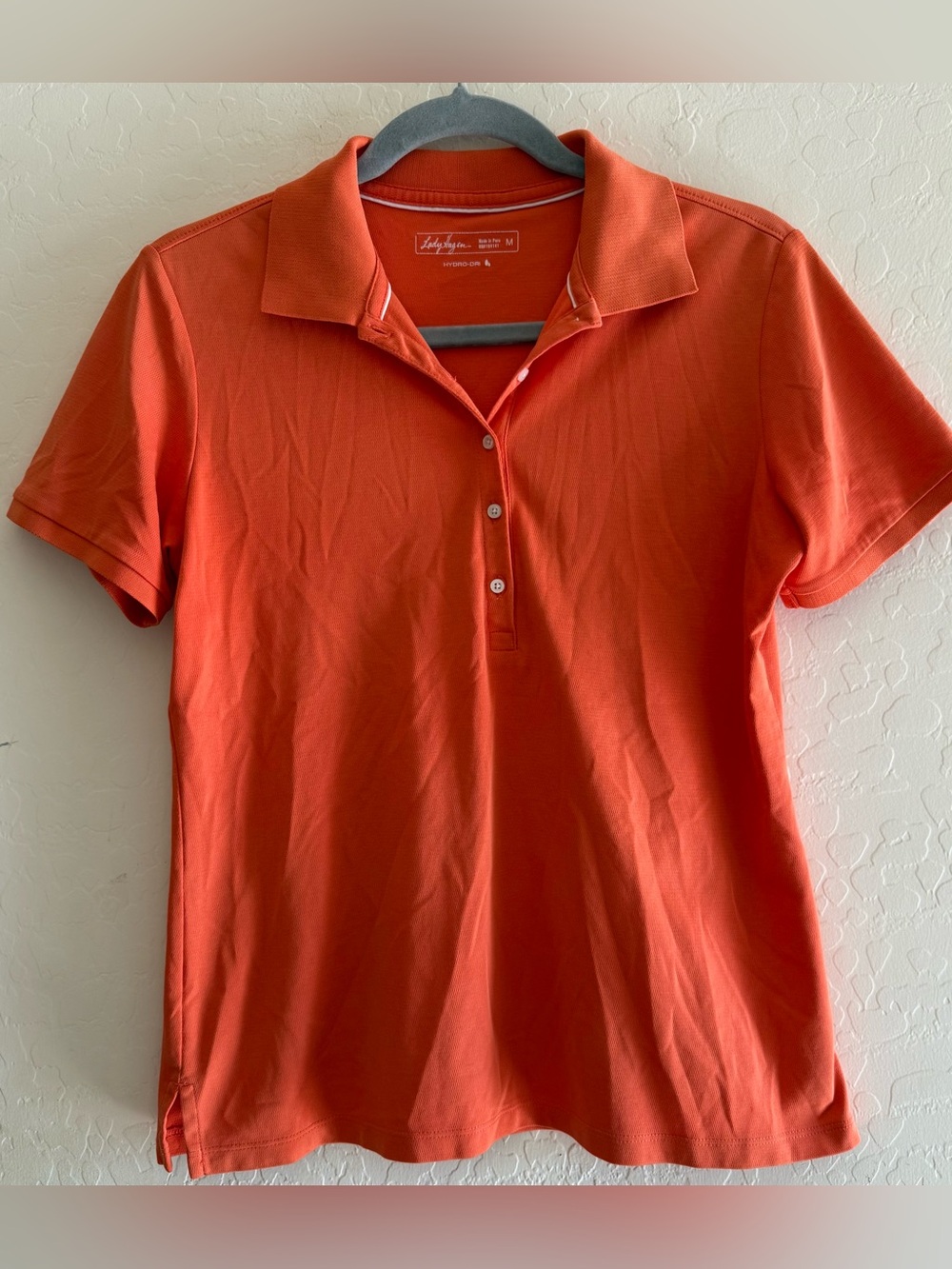 Lady Hagen, medium, orange polo shirt